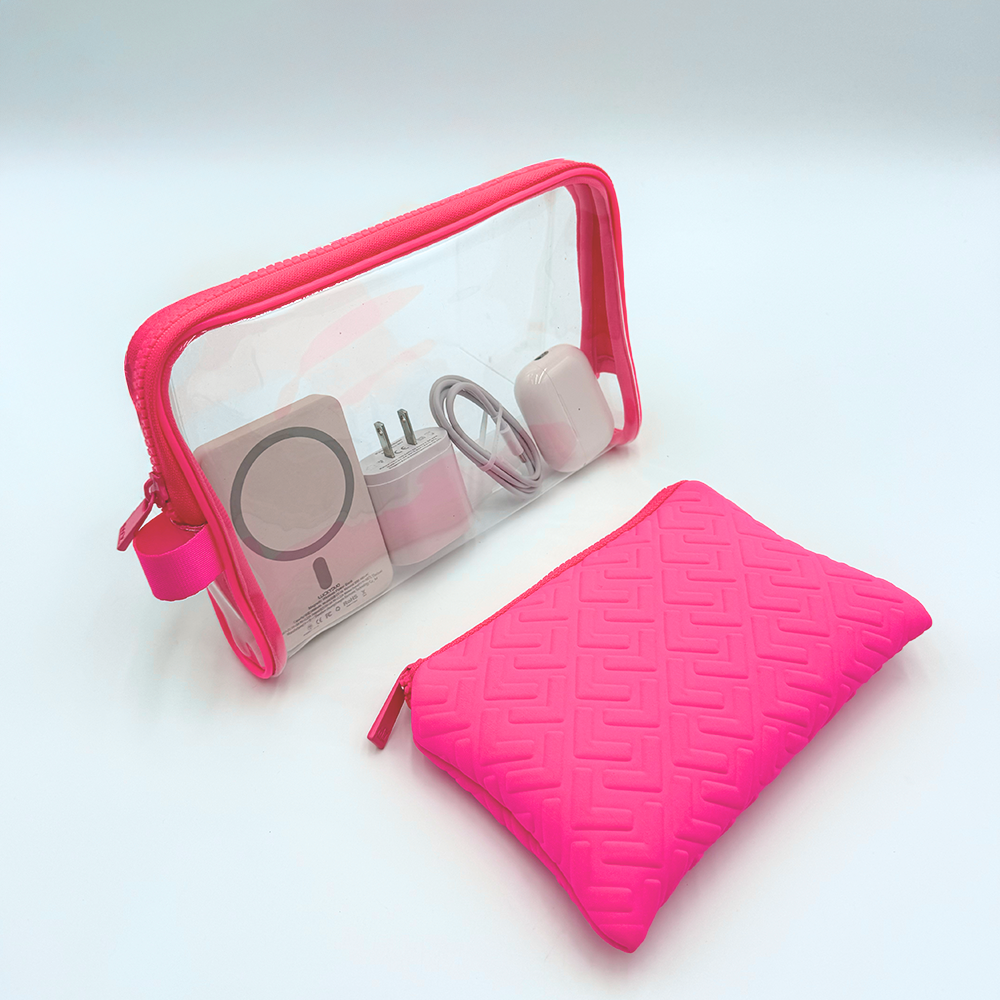 Pink makeup bag with clear pouch and pink pouch on a white background