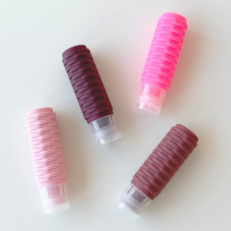 SET OF 4 SILICONE TRAVEL BOTTLES